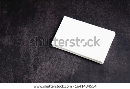   Mockup white business card on black background.                             