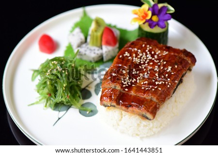 Delicious seafood and eel rice on the plate