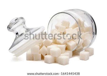 sugar cubes spilled from overturned glass sugar bowl  isolated on white background Royalty-Free Stock Photo #1641445438