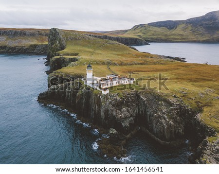 the light house stand on the edge of the cliff alone