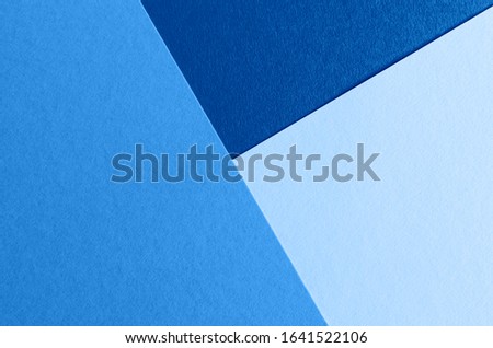 Classic blue color of the year 2020 paper texture background. Three shades of blue.