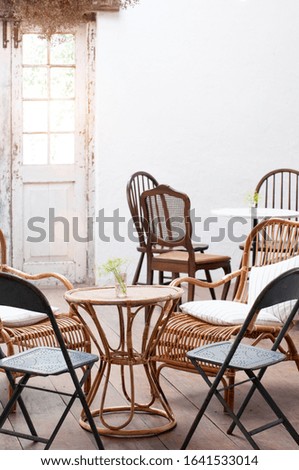 Interior living room vintage conception, rattan table and chair set in dinning room, classic house interior.  