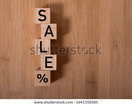 SALE banner concept: word build from wooden cubes with letters