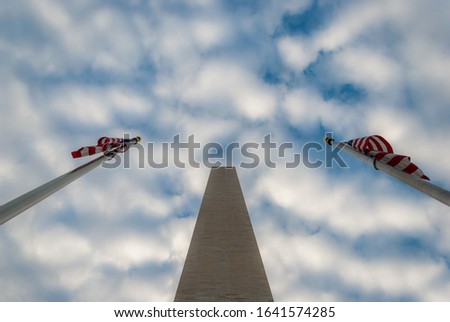 The icon of the whole Washington, D.C. area is the towering tribute to George Washington, surrounded by the american flags.