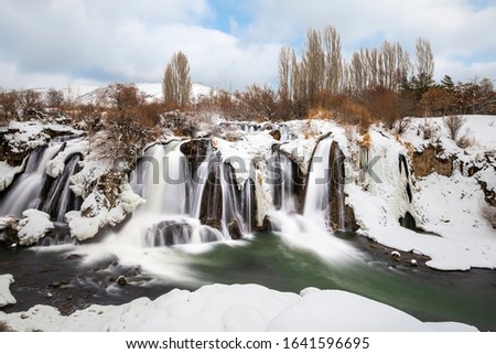 Muradiye Waterfall in Van is still flowing strong in winter. Turkey
