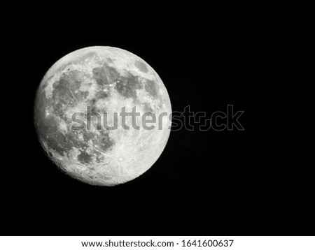 Full moon on a dark background.
