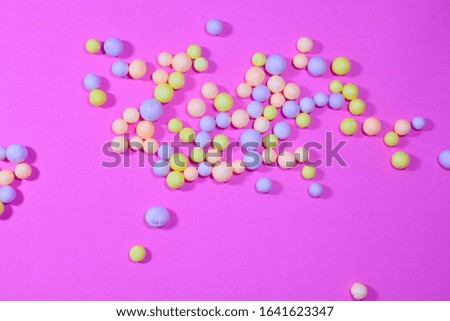 Foam ball on pastel pink background