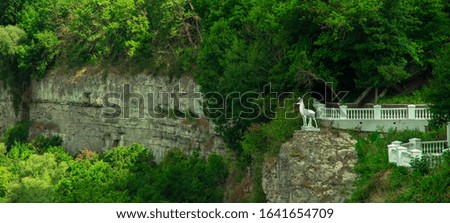 panoramic nature landscape national park summer time vivid green foliage background scenic view white marble fence and deer monument architecture object aerial photography from above 
