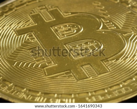 Bitcoin macro close up stock photo. Crypto commerce concept. Web trading bitcoin. Gold mining coin.