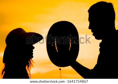 happy cowboy couple silhouette background