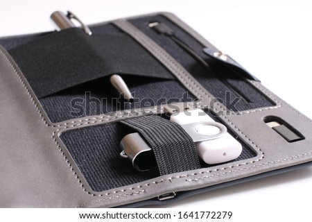 Organizer for business. Selective focus. Pen, flash card, charger.
