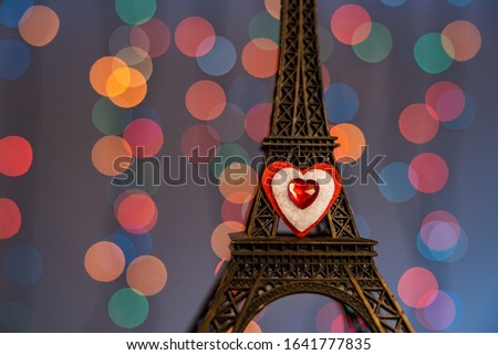 Valentine's day, romantic still life, Eiffel tower with a heart, on a blurred background, bokeh effect, shallow depth of field. Beautiful holiday picture.