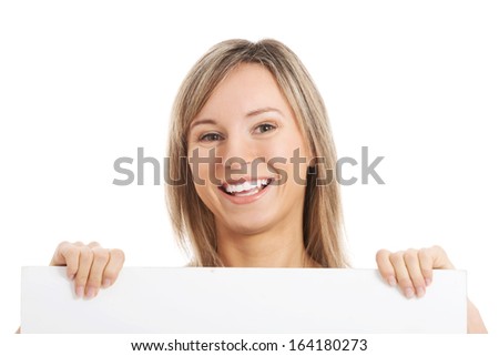 Young hapy girl holding a copy space. Isolated on white. 