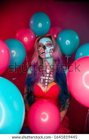 
Girl with creative make-up in the form of a skull.