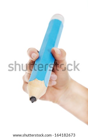 Woman's hand is holding big pencil and writing on copy space.  Isolated on white.