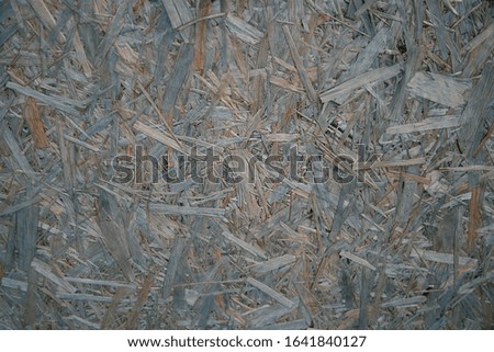 Natural blurred background, selective focus. The structure of the different layers of wood shavings, sawdust and after the process pressure. Wood stove