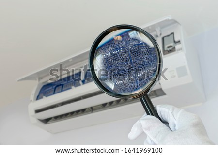 Picture from a magnifying glass Dust and dirt on air filters In air conditioners