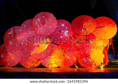 A traditional Chinese dance performed with a flowered paper umbrella as a prop Royalty-Free Stock Photo #1641985396