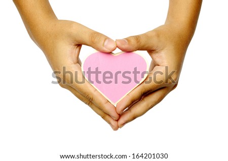 Human hand holding heart shape wooden sign isolated over white background. You can put your design here