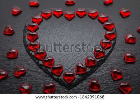 valentines day background with red hearts on black