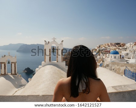 Asian Girl Enjoying the View in Oia Santorini