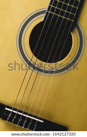 Acoustic guitar close up. musical instrument. strings on the guitar neck