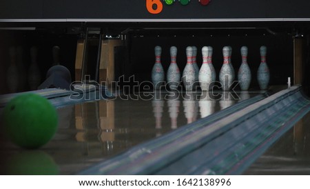 Bowling game. Path. The ball breaks skittles