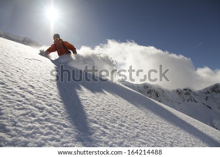 Snowboard freerider  in the mountains Royalty-Free Stock Photo #164214488