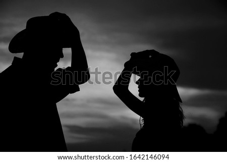 happy couple in love cowboys silhouette