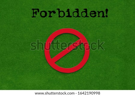 Forbidden! Sign on a green background.
