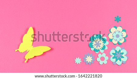 animation paper. Colored butterflies fly around on a colored paper background.