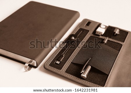 Organizer for business. Selective focus. Handle, battery charger for flash cards