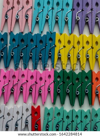 Decorative clothespins, clips of different colors as a background