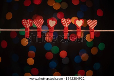 Valentine's Day, romantic still life, hearts on a clothespin, blurred background, bokeh effect, shallow depth of field. Beautiful holiday picture.