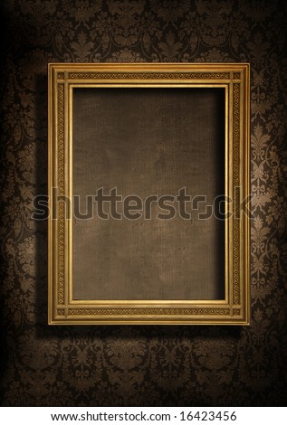 Dark, grungy wall with Victorian wallpaper and gold frame