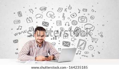 Good-looking young businessman with all kind of hand-drawn media icons in background