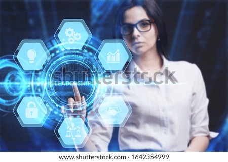 Business, Technology, Internet and network concept. Young businessman working on a virtual screen of the future and sees the inscription: Leadership