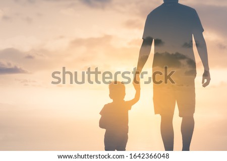 father and son holding hands walking into the golden sunset. Father's Day, fatherhood and parenting concept. Double exposure  Royalty-Free Stock Photo #1642366048