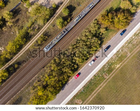 Train race with cars from above drone picture