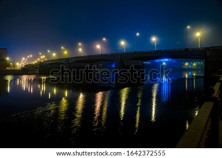 bridge over the river at night lights on the bridge