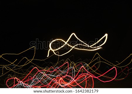 Colorful abstract line light art with black background. Conceptual art showing motion, pulse of the city of Helsinki & darkness of the night. Created by moving camera with long exposure.