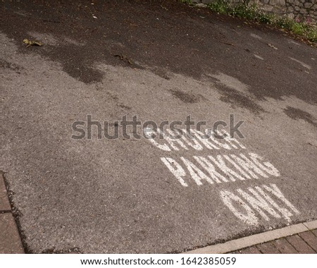 Church parking only sign painted on the road