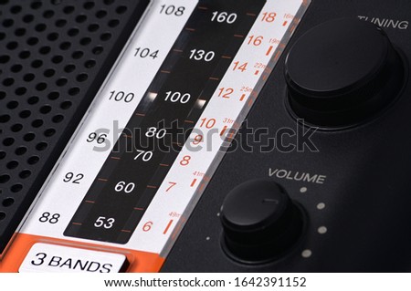 Vintage radio for listening to radio programs on an isolated white background