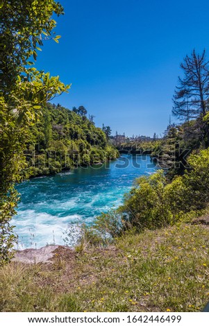 Waikato River near Huka Falls, New Zealand, in summer. Royalty free stock photo.