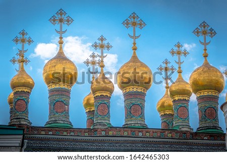 Verkhospasskiy Sobor - Golden onion towers of church inside Kremlin, Moscow, Russia, in summer. Royalty free stock photo.
