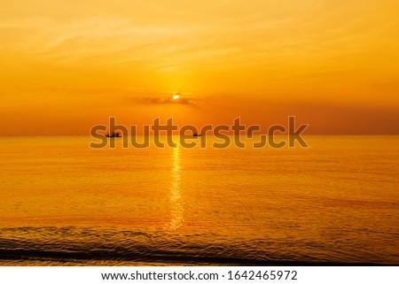 panoramic view of tropical surfers at sunset morning sky