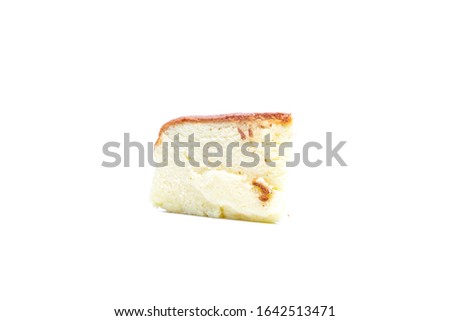A picture of sliced moist cheesecake on white background.