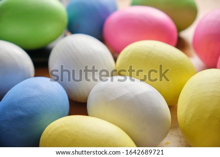 multicolored artificial Easter eggs made of wood