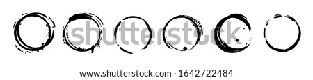 Set of black ink grunge texture circle blots. Brush strokes paint frames collection. Vector elements isolated on white background.