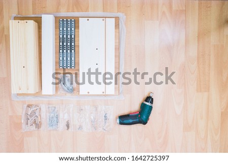 assemble furniture top view  in wooden background